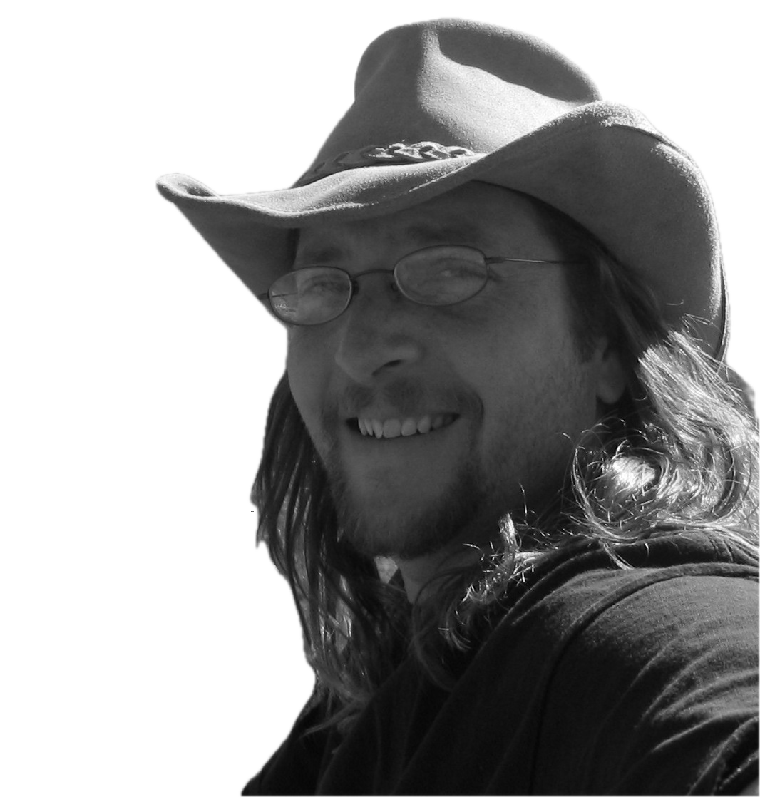 Man wearing a cowboy hat, smiling portrait.