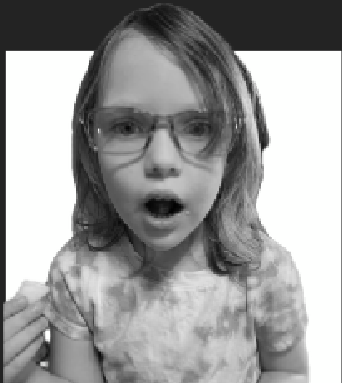 Child with glasses looking surprised, monochrome image.