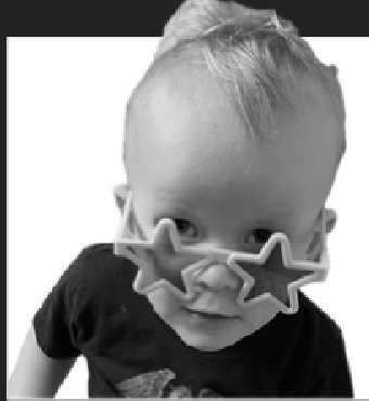 Child wearing star-shaped sunglasses, black shirt.